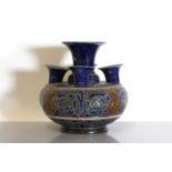 A Doulton Lambeth stoneware crocus vase,