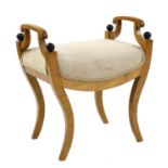 A Biedermeier-style maple and ebonised stool,