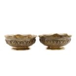 A pair of Indian silver dishes,