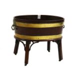 A George III mahogany and brass bound wine cooler,