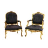 A near pair of giltwood armchairs,
