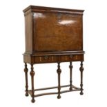 A William and Mary walnut cabinet on stand,