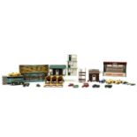 A collection of Tri-Ang Scaletrix model cars and figures,
