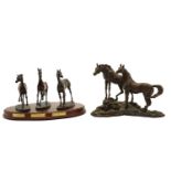 A group of three Franklin Mint bronze horses,