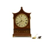 A Regency mahogany and a brass inlaid bracket clock
