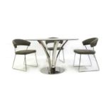 A Moritz circular stainless steel and glass table