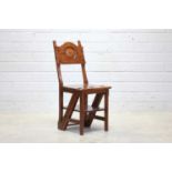An Arts and Crafts walnut metamorphic library chair,