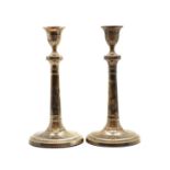 A pair of George III silver candlesticks,