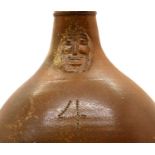 A large salt glazed Bellarmine jug,