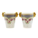 A pair of Sevres-style 'Empire' porcelain cachepots,