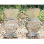 A pair of composite stone planters