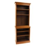 A Victorian walnut two tier open bookcase,