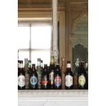 A collection of nine commemorative Guinness bottles,