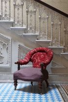 A Victorian walnut-framed horseshoe-back library chair,