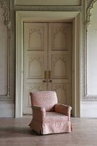 A Victorian mahogany-framed upholstered armchair by J Mills,