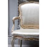 ☘ A Louis XV-style parcel-gilt salon chair,