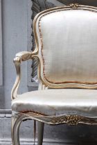 ☘ A Louis XV-style parcel-gilt salon chair,