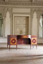 A George IV satinwood and mahogany bow-front sideboard,