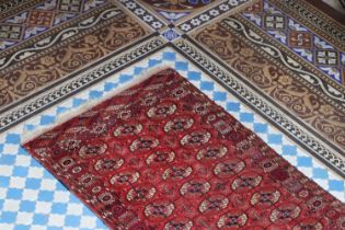 ☘ A small Turkoman brick-ground rug,