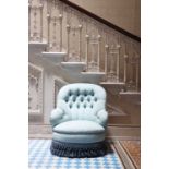 A button-upholstered spoon-back armchair,