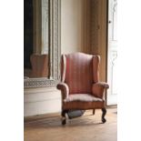 A mahogany George III-style wingback armchair,