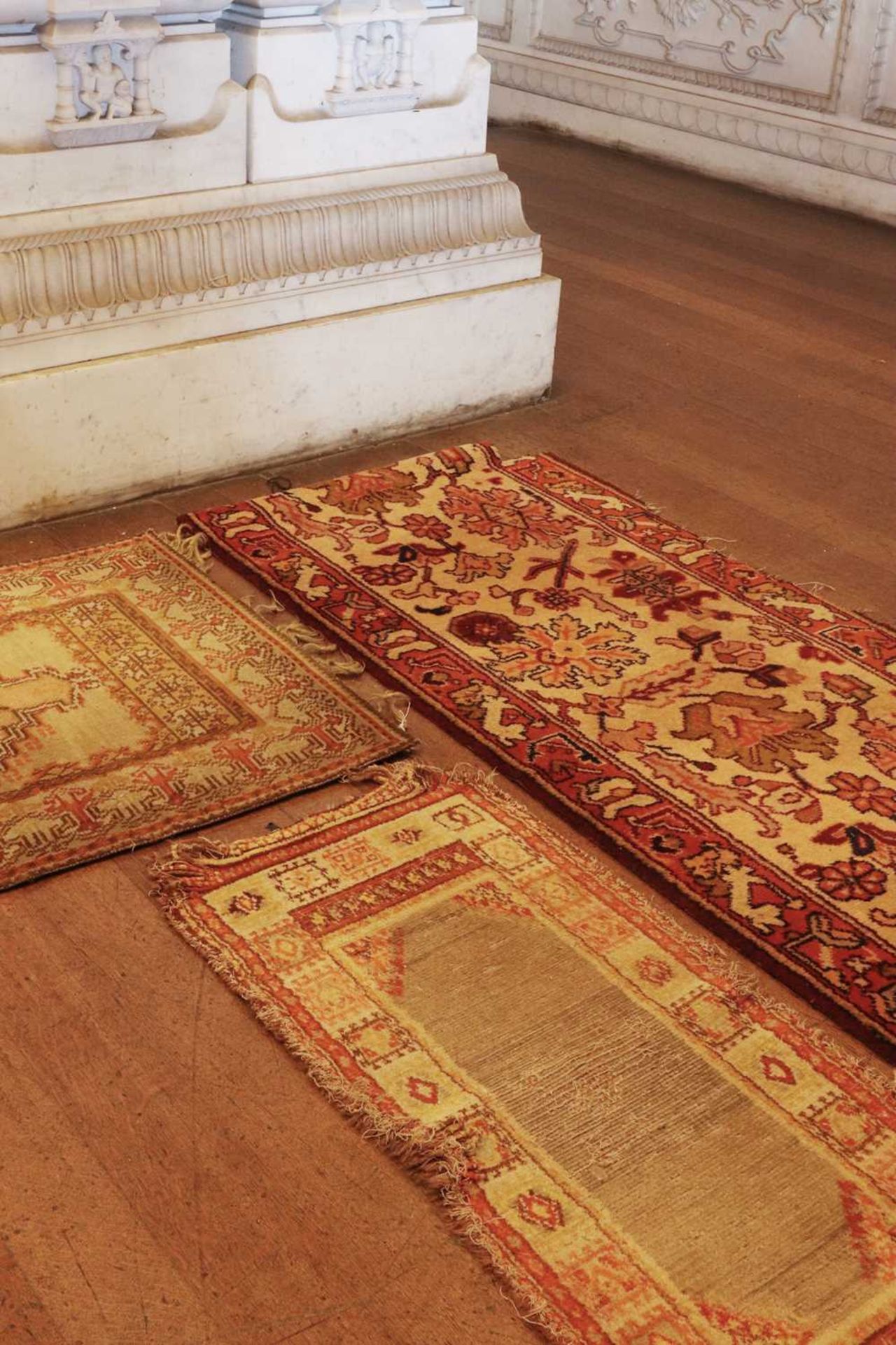 ☘ A group of three rugs,