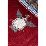 ☘ A large red velvet and metal thread embroidered armorial hanging,