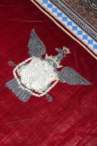 ☘ A large red velvet and metal thread embroidered armorial hanging,