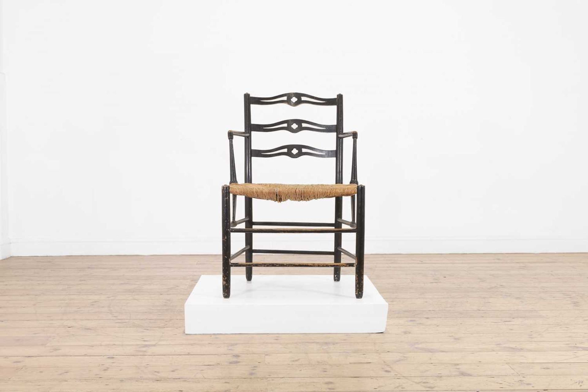 An ebonised wooden elbow chair, - Bild 3 aus 20
