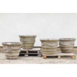 Four large composite stone planters,