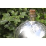 A mirrored-glass carboy,