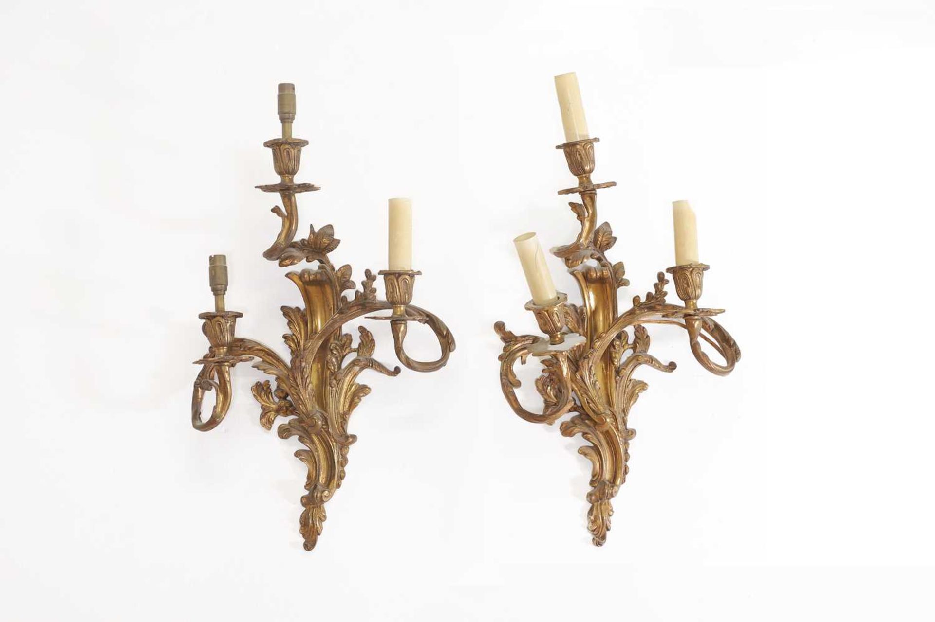 A pair of Louis XV-style gilt-brass wall lights,