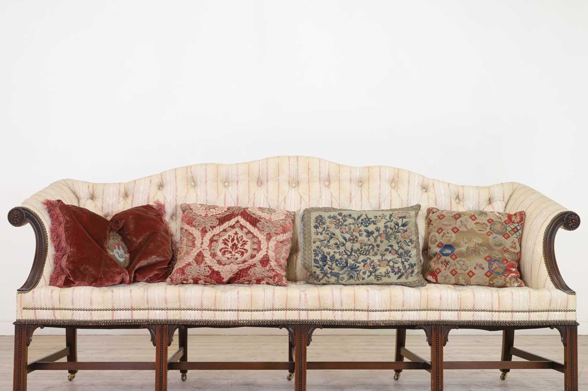 A group of four cushions,