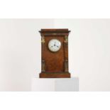 An Empire burr elm and gilt-metal mantel clock by Lépine of Paris,