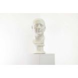 A plaster bust after the antique,