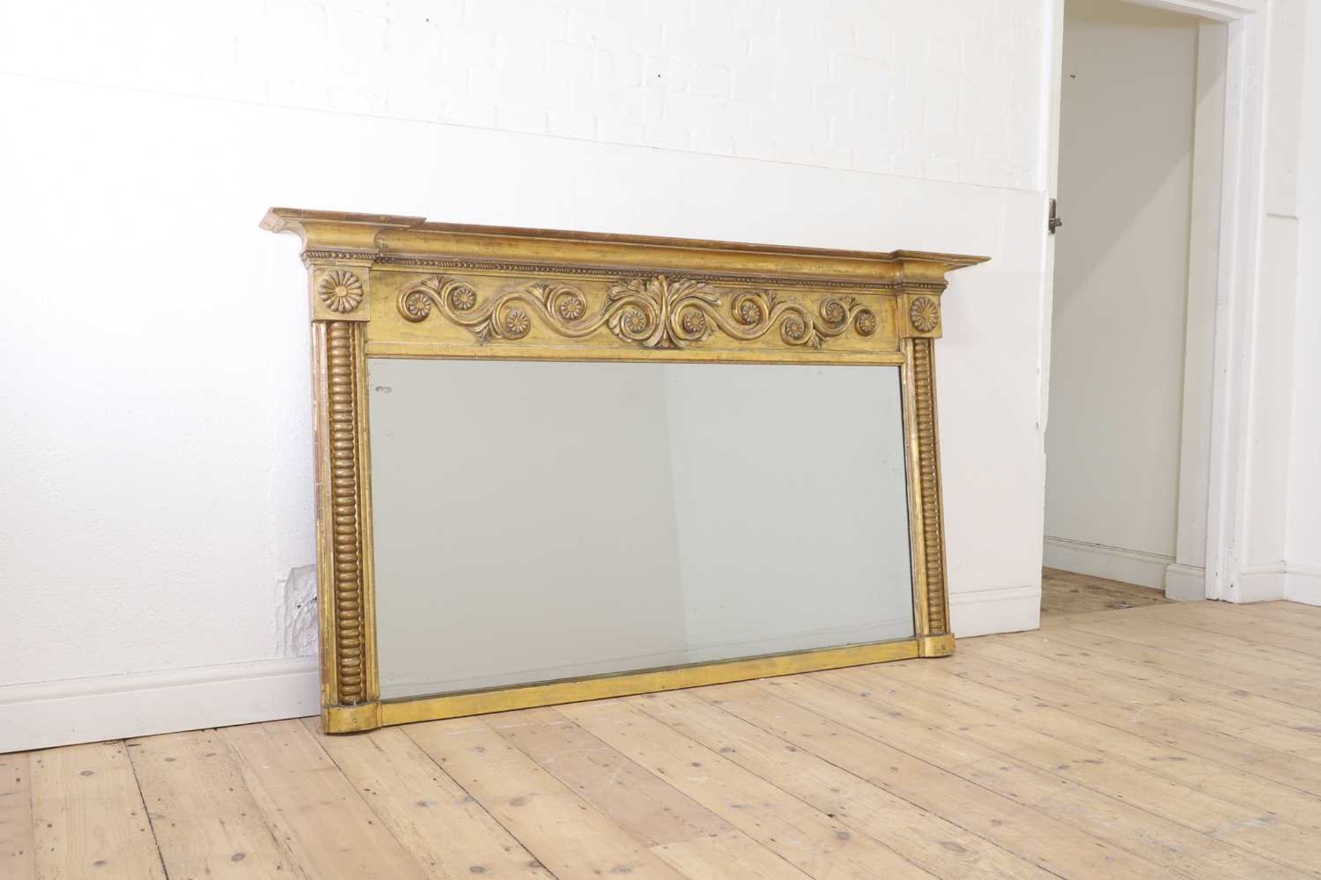 A George IV giltwood and gesso overmantel mirror