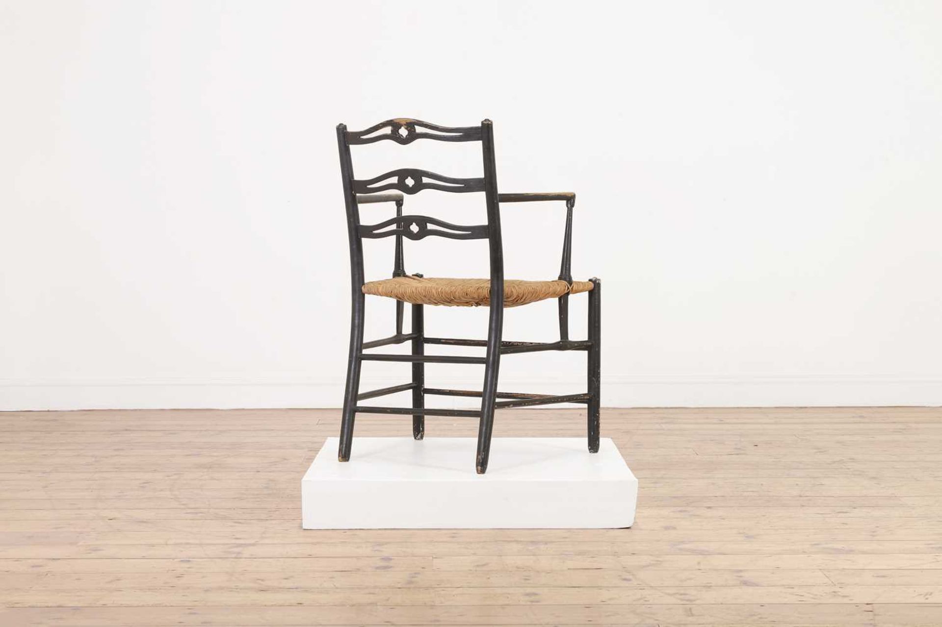 An ebonised wooden elbow chair, - Bild 4 aus 20