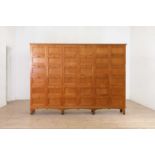 A large solid satinwood cabinet from the Edward Grey Institute of Field Ornithology,