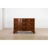 A George III mahogany serpentine commode,