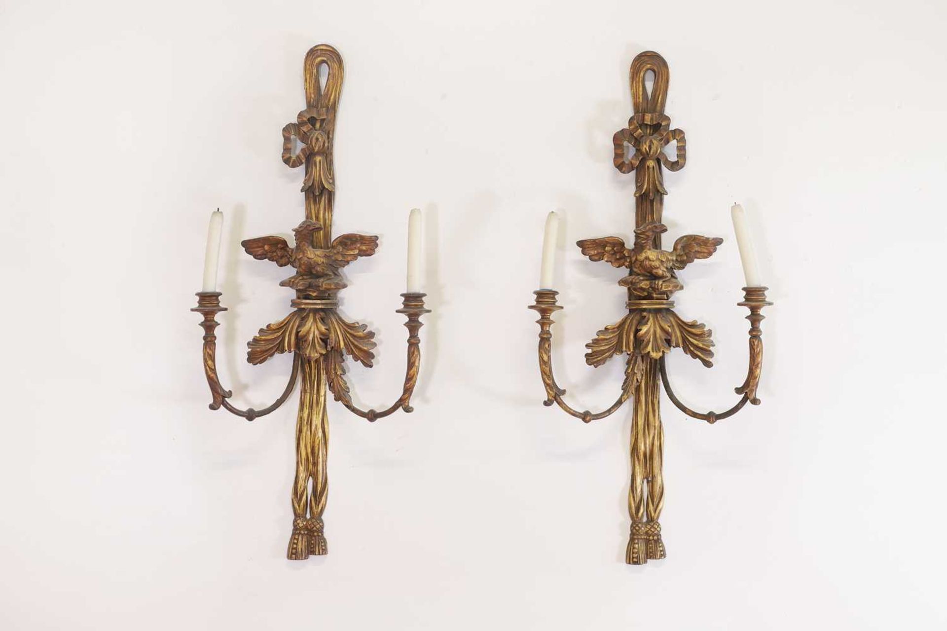 A pair of George III-style carved giltwood wall sconces,
