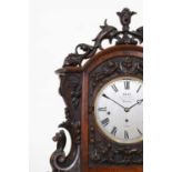 A large Victorian carved walnut table clock by Dent of London,
