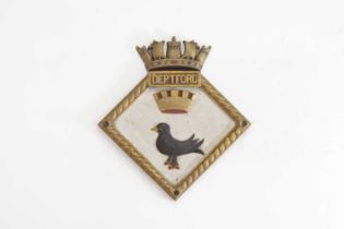 A gilt and painted bronze ship's badge,