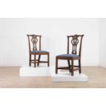 A pair of George III mahogany side chairs,