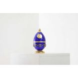 A silver-gilt and enamel egg,