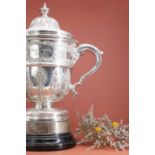 A large Victorian silver golfing cup and cover,