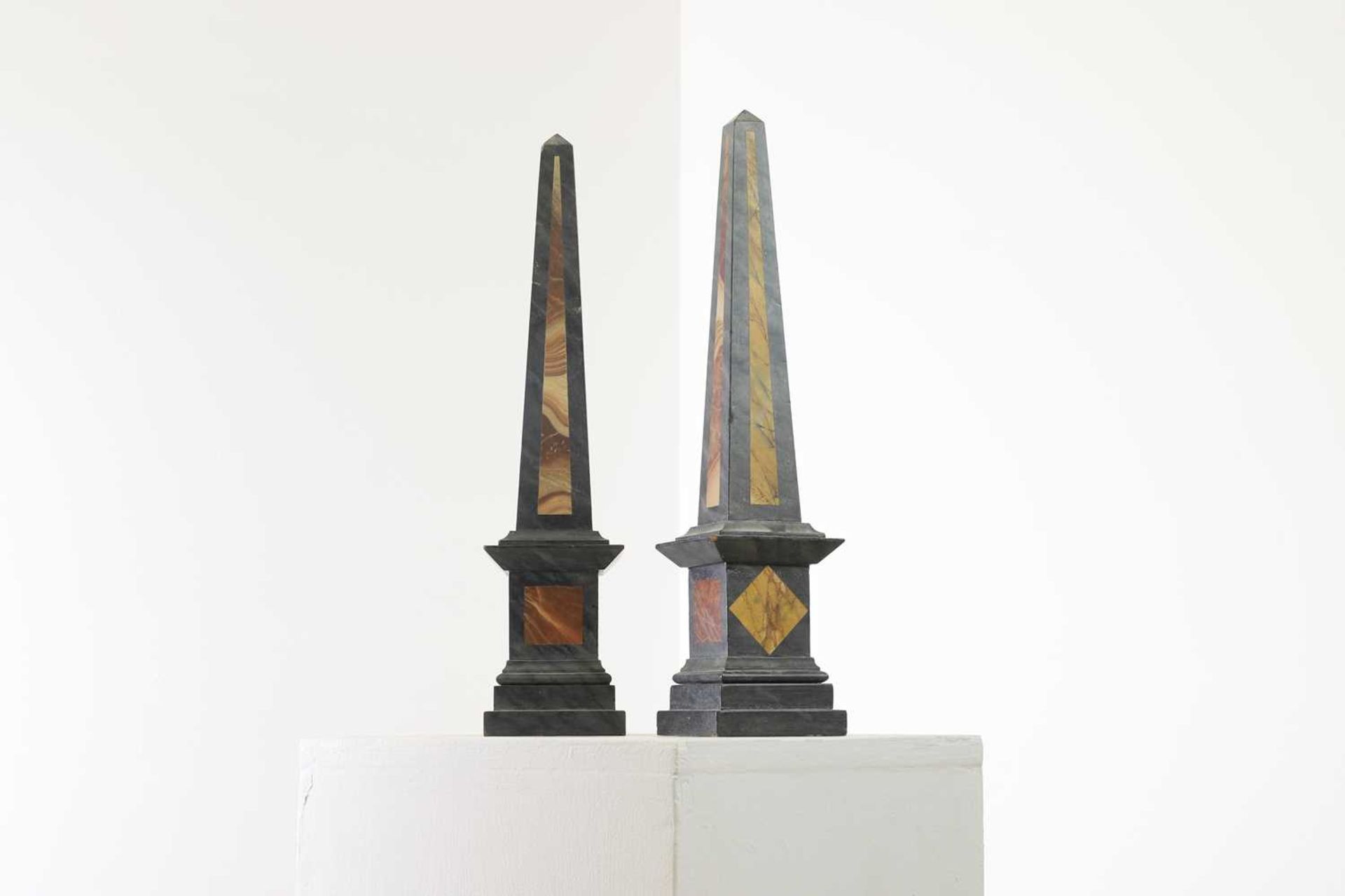 A pair of simulated pietra dura obelisks,