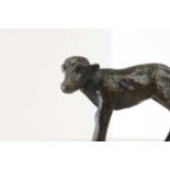 A small patinated bronze figure,