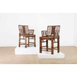 A pair of bent bamboo chairs,