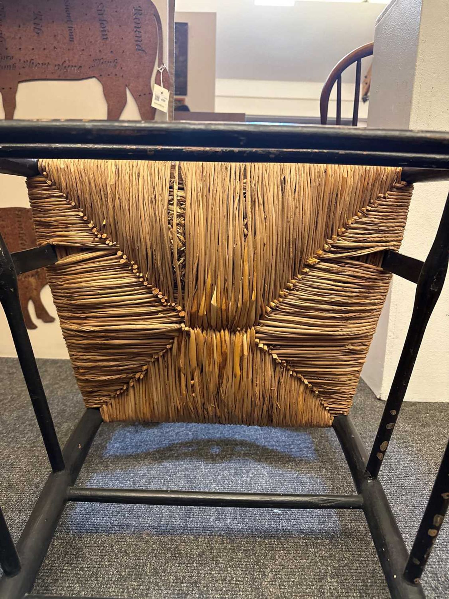 An ebonised wooden elbow chair, - Bild 10 aus 20