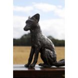 A patinated bronze figure of a fox,